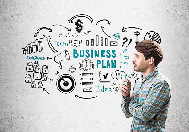 istock Side view of man with stable and business plan 636715854
