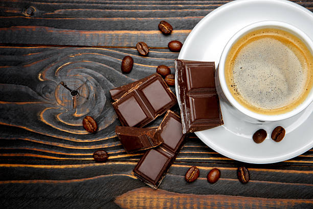 istock fresh cookies and coffee on wooden background 636717186