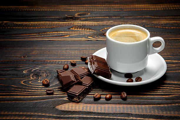 istock fresh cookies and coffee on wooden background 636717282