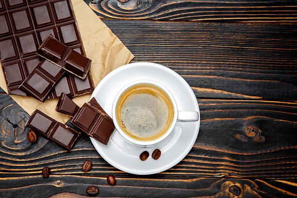 istock fresh cookies and coffee on wooden background 636717444