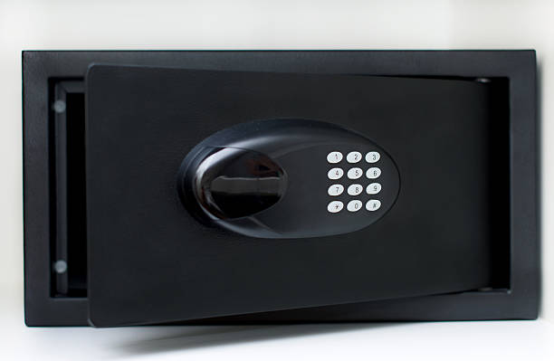 istock Black small home or hotel safe with keypad. 636717546
