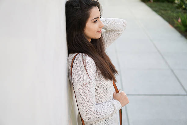 istock girl brunette on the street 636717630