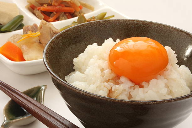 istock Raw egg over rice and simmered vegetable, Japanese food 636717786
