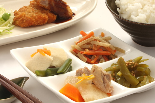 Simmered vegetable, deep fried pork and rice, typical side dishes of Japanese home cooking.