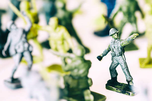 istock Crowd of little soldier toy in selective focus war concept 636720946