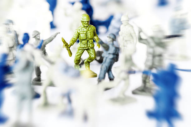 istock Crowd of little soldier toy in selective focus war concept 636721204