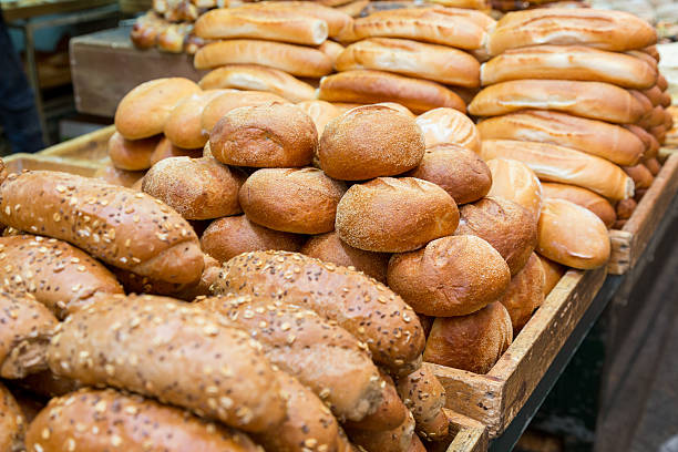 istock fresh baked buns and loafs on a market 636721980