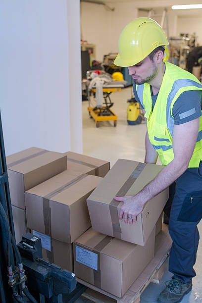 Stack Box Employee 700+ Warehouse Worker Lifting Boxes Stock Photos, Pictures & Royalty ...