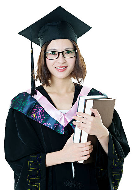 istock Female graduate holding books 636727658