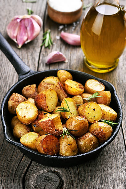 istock Baked potato in frying pan 636727824