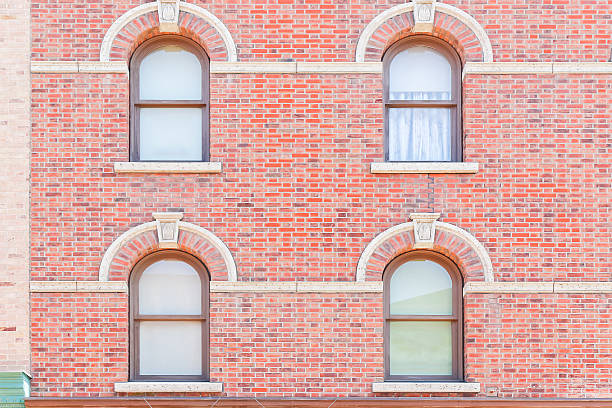 istock Windows exterior on old building with red brick. 636728086