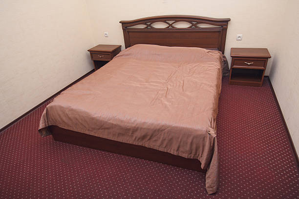 istock Bed and bedside tables in the hotel. Interior 636729214