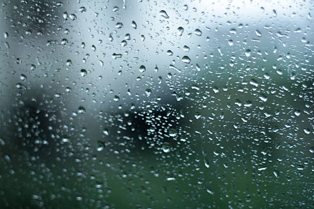 istock Drops of rain on the window (glass) with blurred background 636729714