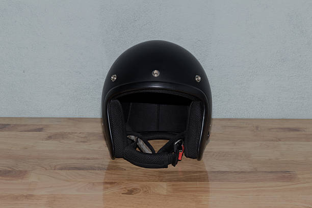 istock Motorcycle helmet on wooden table 636729772
