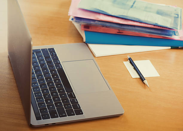 istock The laptop with the notepad on the desk in the office 636731006