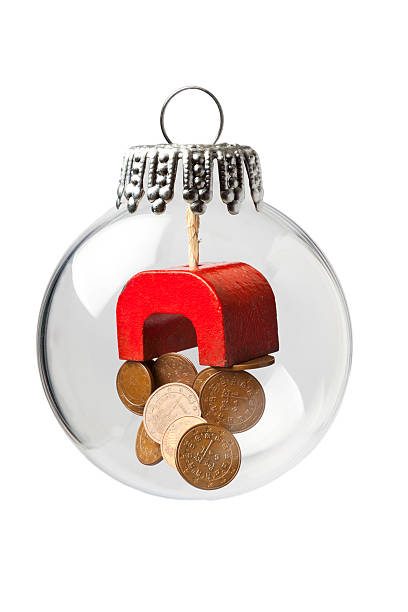 istock Magnet and Coins in a Christmas Ornament 636731922