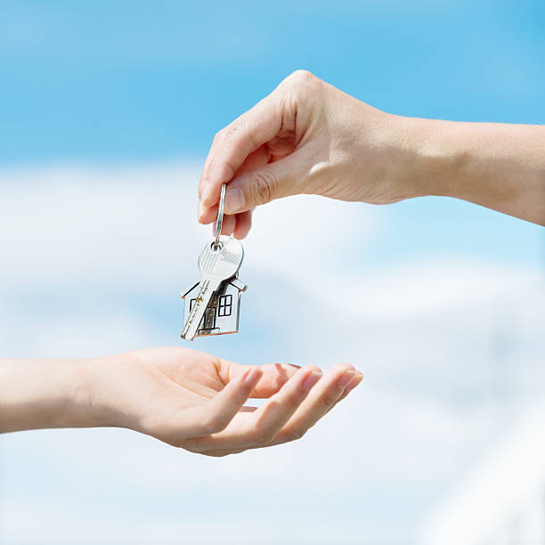 istock Handing over the house keys 636732466