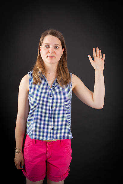 istock Beautiful woman doing different expressions in different sets of clothes: wave 636734122