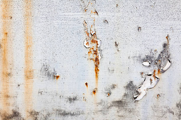 istock Peeling Paint on Rusted Metal Texture Background 636735958