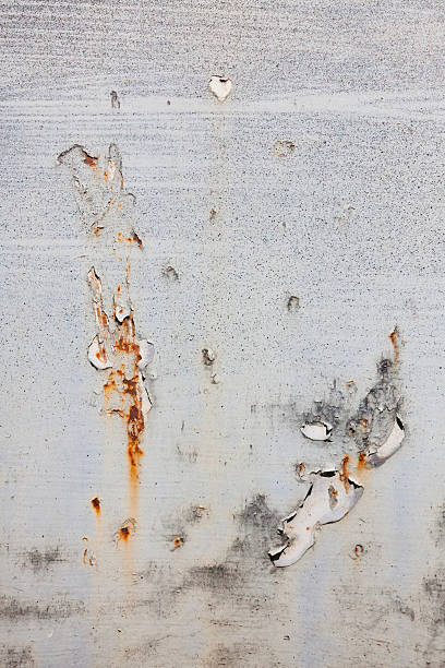 istock Peeling Paint on Rusted Metal Texture Background 636735960