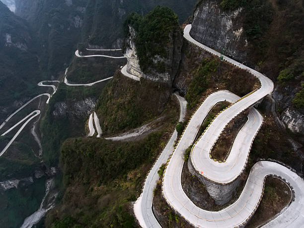 Tianmen Mountain Amazing road in Tianmen Mountain, Zhangjiajie National Park, China overhead cable car photos stock pictures, royalty-free photos & images