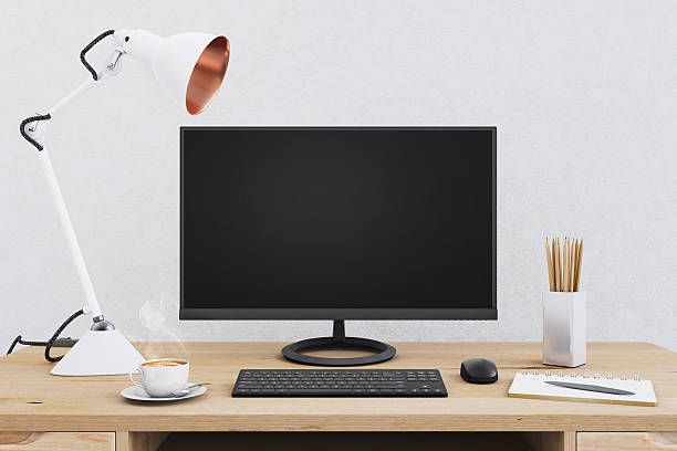 istock Large PC monitor on an office desk 636738858