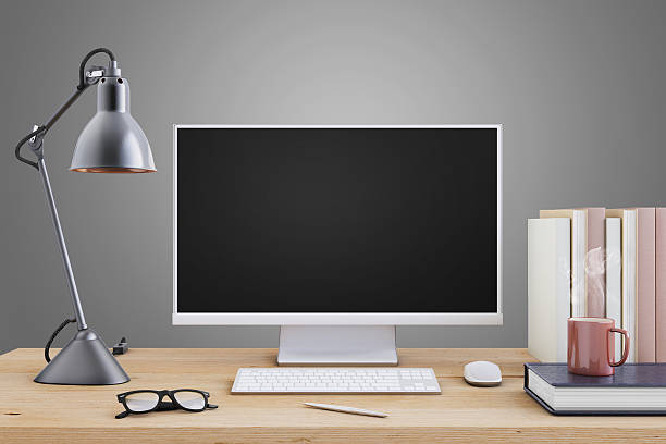 istock Large PC monitor on an office desk 636738882