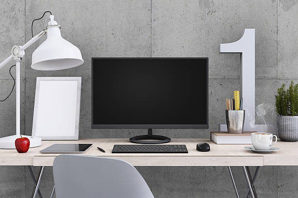 istock Large PC monitor on an office desk 636738972