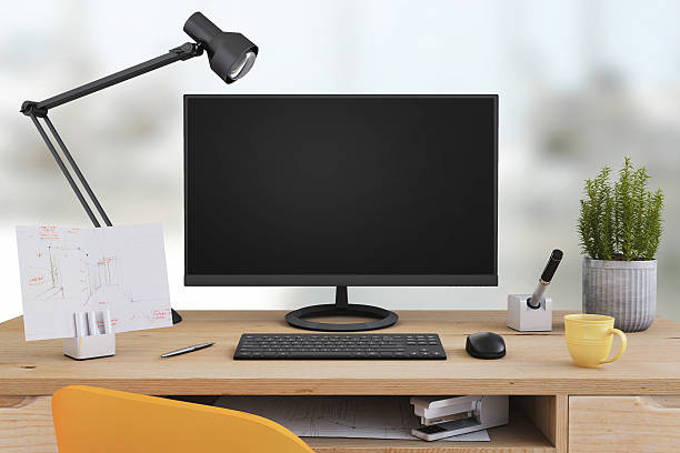 istock Large PC monitor on an office desk 636739006