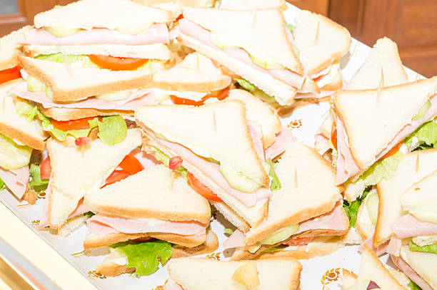 istock sandwiches with ham and tomato salad 636741696