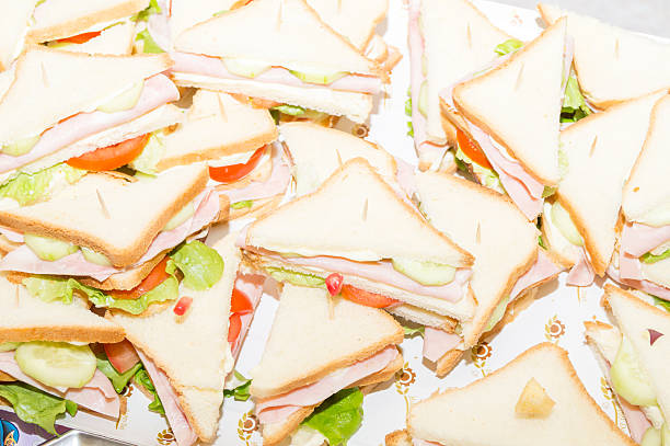 istock sandwiches with ham and tomato salad 636741732
