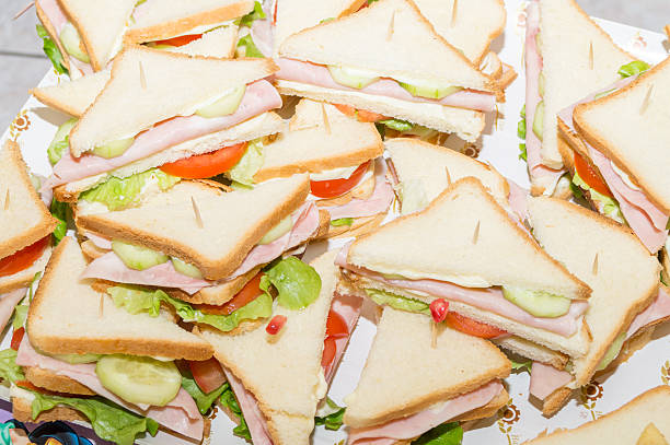 istock sandwiches with ham and tomato salad 636741774