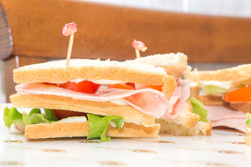 sandwiches with ham and tomato salad