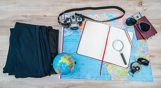 istock Travel items on hardwood floor 636742156