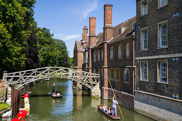 Mathematical Bridge in Cambridge Cambridge, UK - July 18th 2016: A view of the historic Mathematical Bridge over the River Cam in Cambridge, UK. queens college stock pictures, royalty-free photos & images