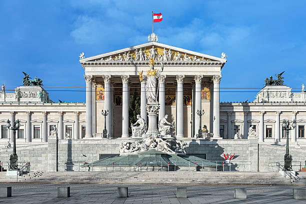austrian parliament building and pallas athene fountain in vienna - austrian parliament imagens e fotografias de stock