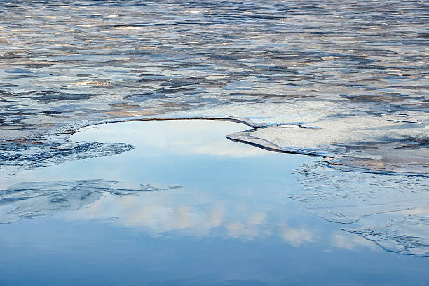 istock water and broken ice pieces in lake 636745134