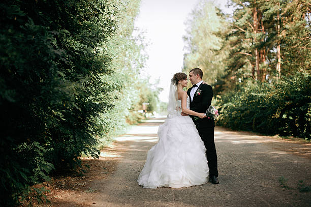istock Elegant young happy wedding couple 636747116
