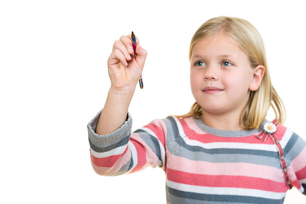 istock cute little girl drawing in the air or imaginary screen 636747456