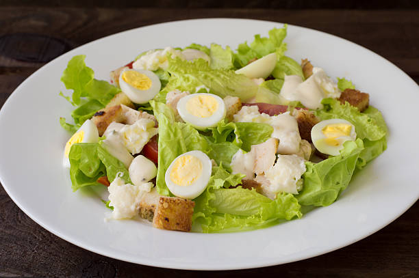 istock Salad with radishes, arugula, chicken and quail egg on a 636747672