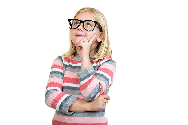istock Adorable child in glasses thinking isolated on white 636749034