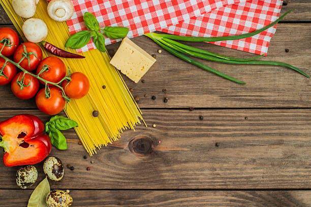 istock Dry pasta with tomatoes, herbs and spices for tomato sauce 636749556