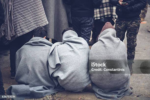 Migrants And Blankets Stock Photo - Download Image Now - Refugee, Afghanistan, Refugee Camp