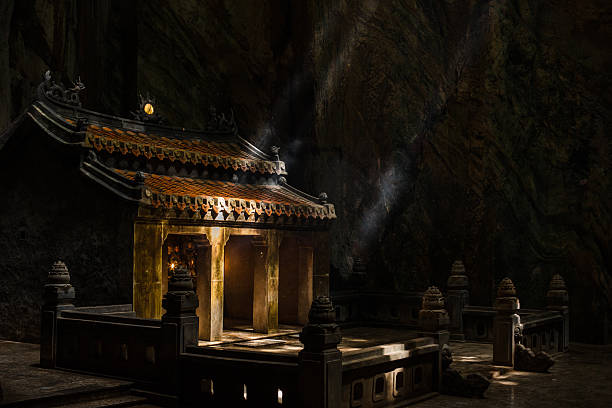 istock Atmospheric temple stone building in cave falls pillar sunlight 636751818