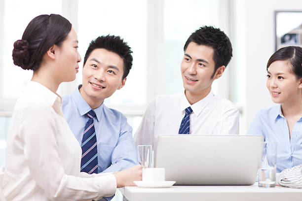 istock Group of businesspeople discussing in office 636753754