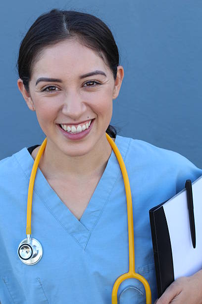 istock Female health care worker isolated on blue 636754318