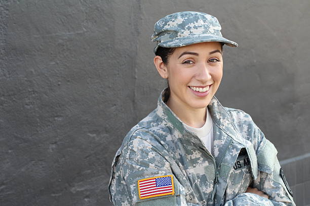 istock Young girl wearing green military style uniform 636754502