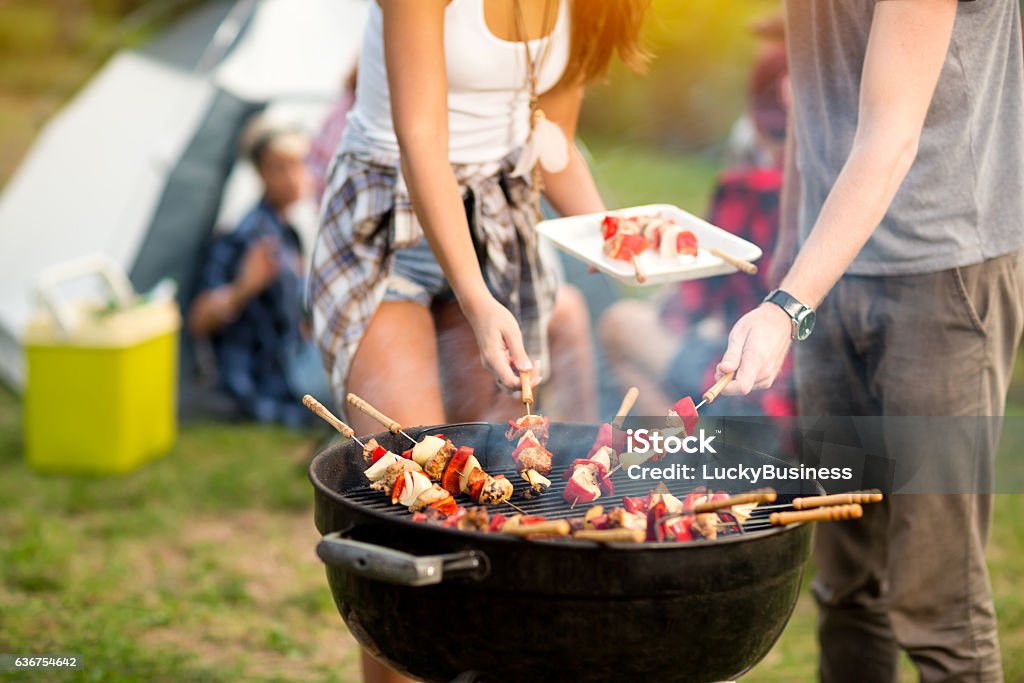 Close up grill with barbecue Close up grill with colorful barbecue on grill in campground Camping Stock Photo