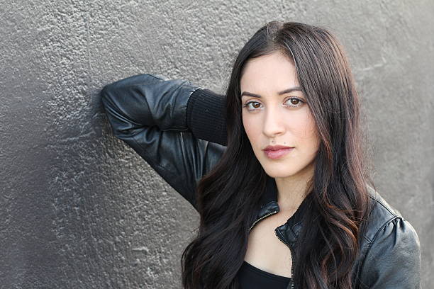 istock Hispanic Brunette Woman in Black Leather Jacket 636755032