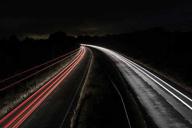 istock Streaks of light from cars 636756466